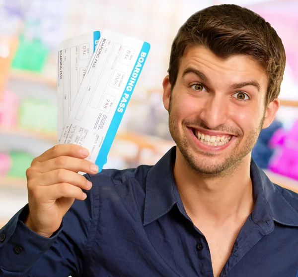 A Young Man Holding Boarding Pass — Stock Photo, Image