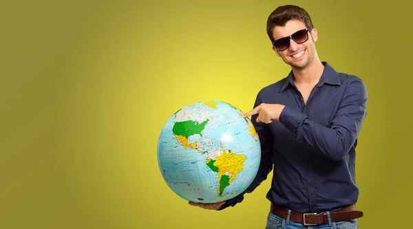 A Young Man Pointing On A Globe — Stock Photo, Image