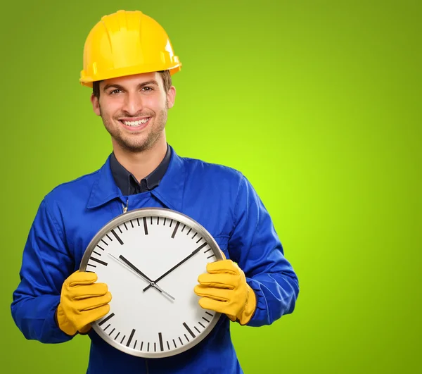 Engineer Holding Wall Clock — Stock Photo, Image