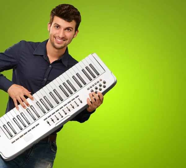 Young Man Holding Piano — Stock Photo, Image