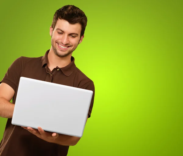 Happy Young Man Holding Laptop Stock Photo