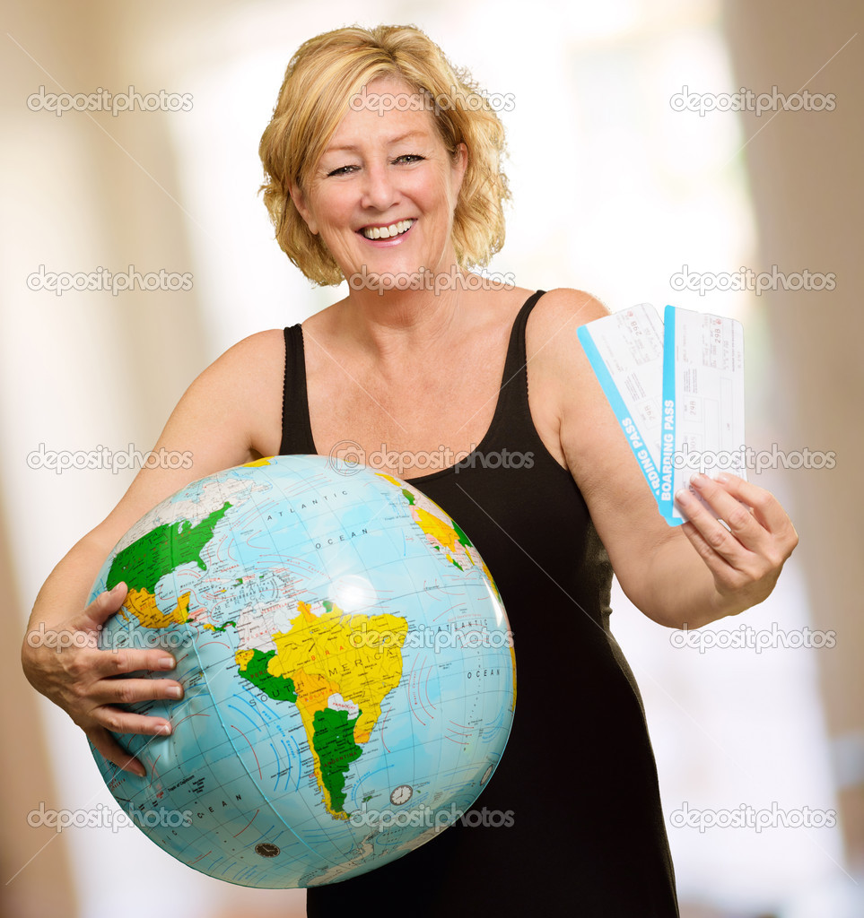 Woman Holding Globe And Boarding Passes