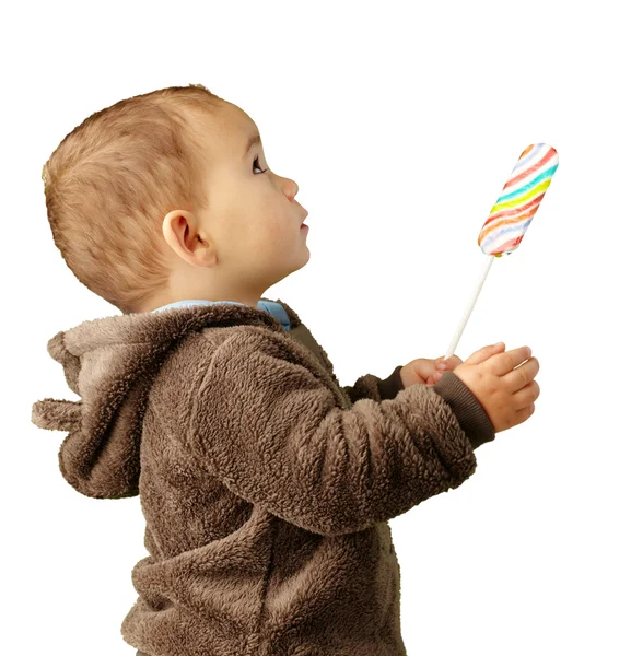 Retrato de un bebé sosteniendo piruleta — Foto de Stock