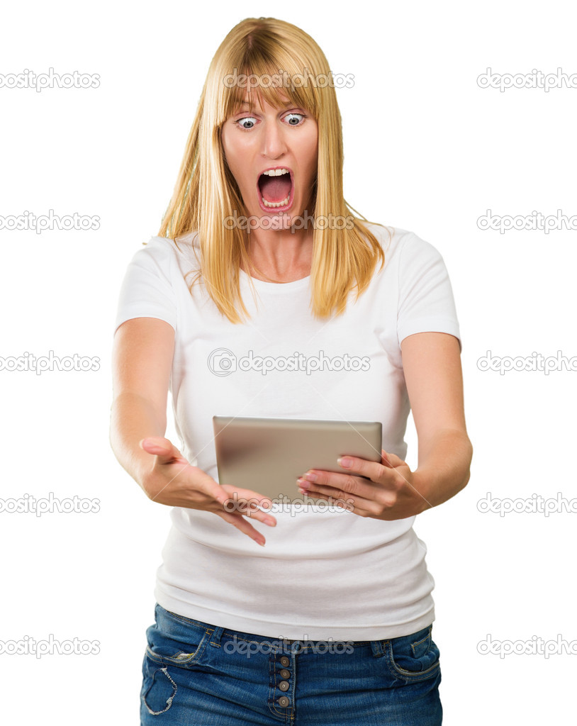 Shocked Woman Looking At Digital Tablet