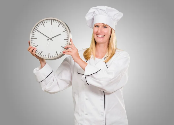 Female Chef Holding Clock — Stock Photo, Image