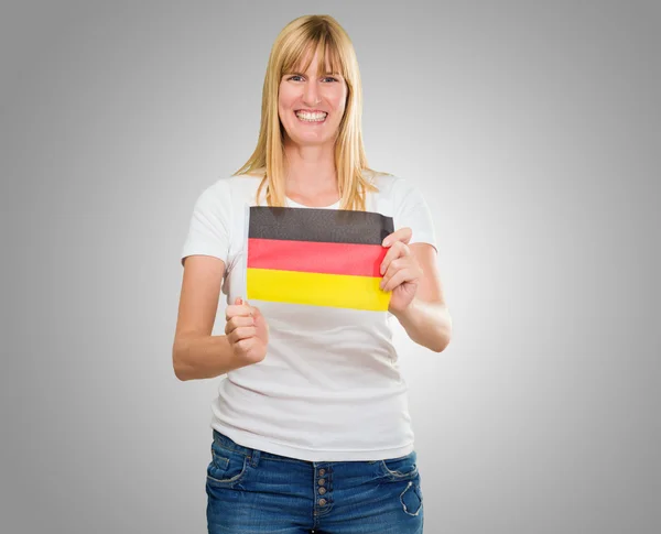 Mulher segurando uma bandeira alemã — Fotografia de Stock