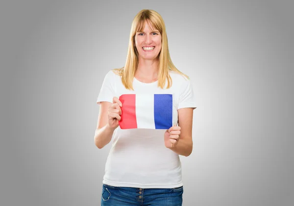 Kobieta trzyma flagę francuski — Zdjęcie stockowe