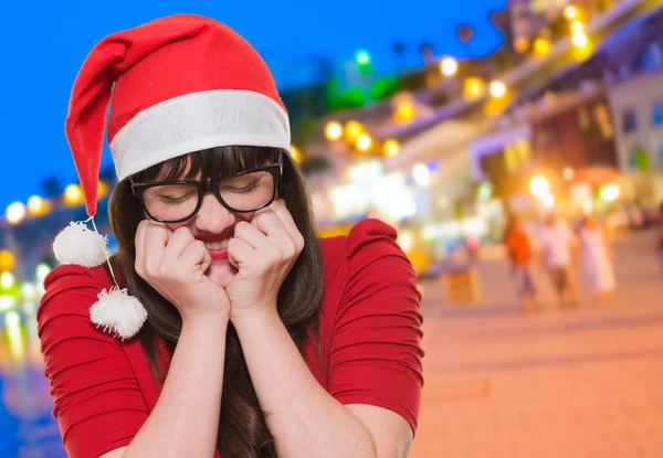 Excited christmas woman with her eyes shut — Stock Photo, Image