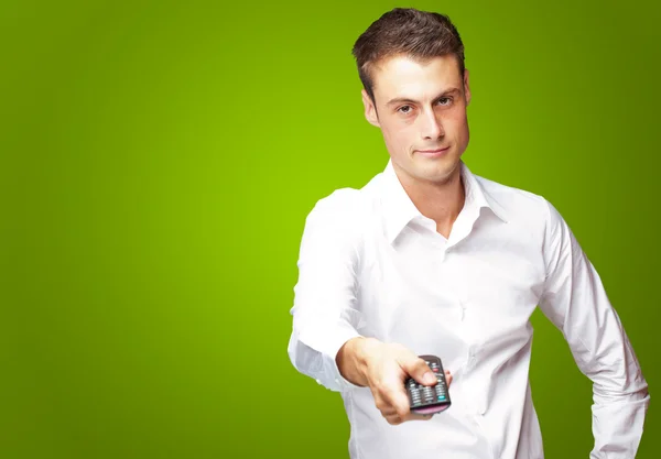 Man Holding Remote In His Hand — Stock Photo, Image