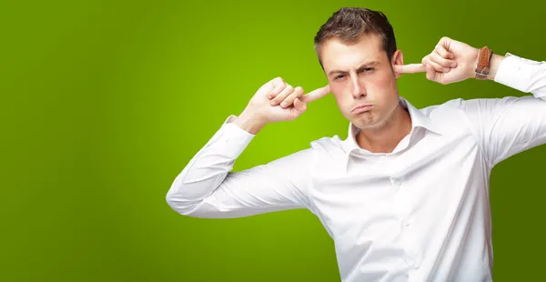 Portrait Of Young Man With Finger In His Ear — Stock Photo, Image