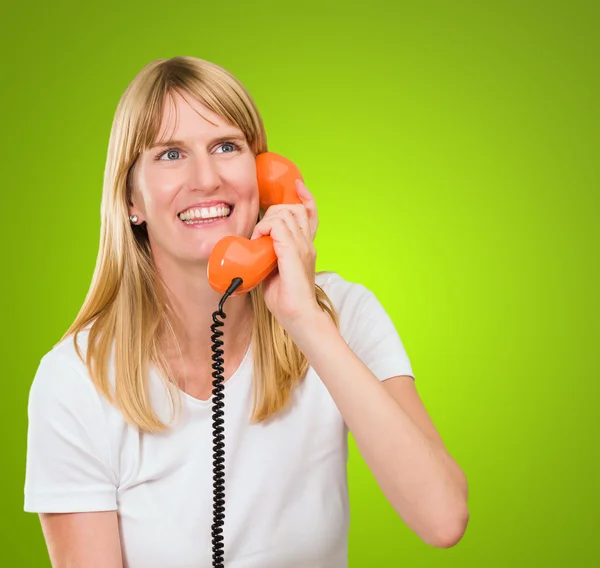 Pretty woman talking on telephone — Stock Photo, Image