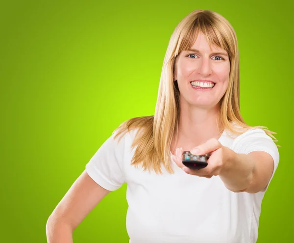Portrait Of A Happy Woman Holding Remote Control — Stock Photo, Image