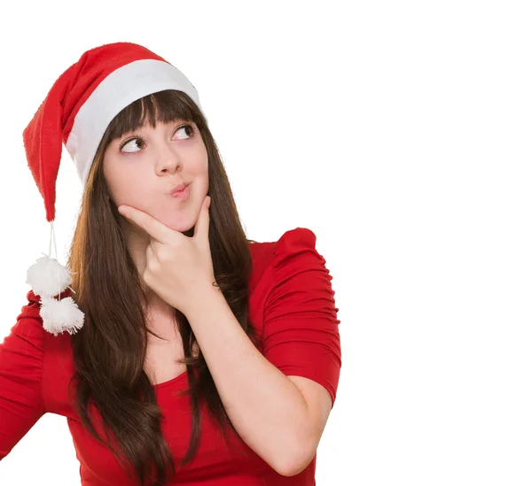 Woman thinking and wearing a christmas hat — Stock Photo, Image