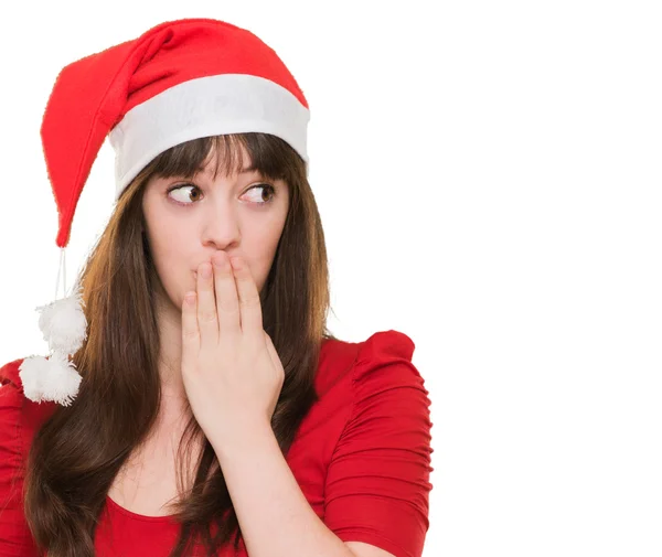 Christmas woman covering her mouth and looking to a side — Stock Photo, Image