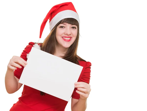 Heureuse femme de Noël tenant une carte blanche — Photo