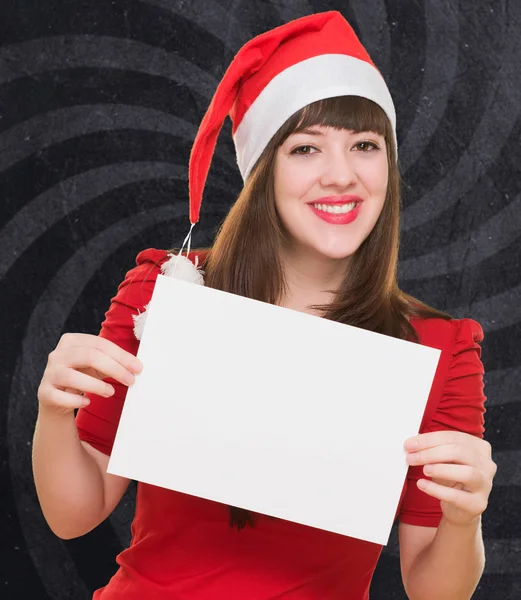 Happy christmas woman holding a blank card — Stock Photo, Image