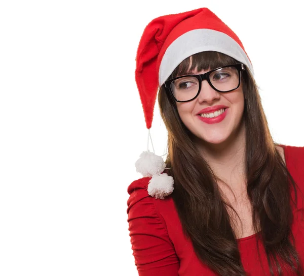 Heureuse femme de Noël portant des lunettes et regardant vers un côté — Photo