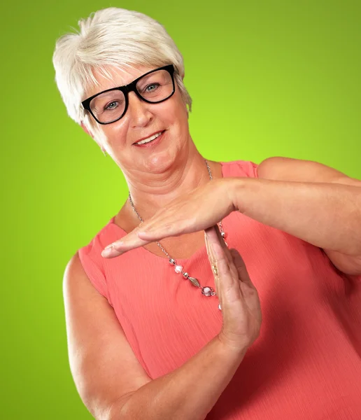 Portrait Of A Senior Woman Showing Time Out Signal — Stock Photo, Image