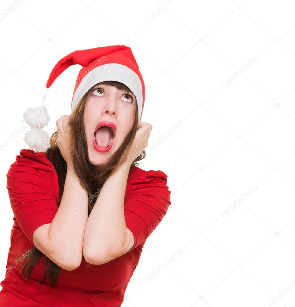 stressed woman wearing a christmas hat