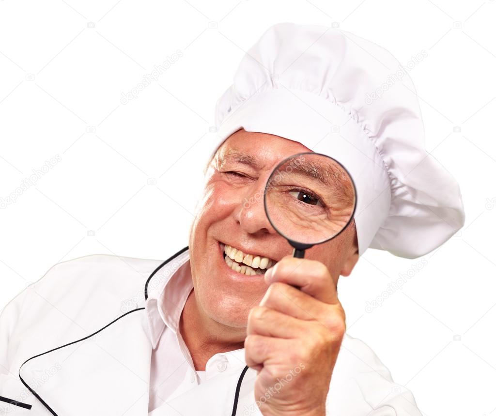 Portrait Of A Chef Holding Magnifying Glass