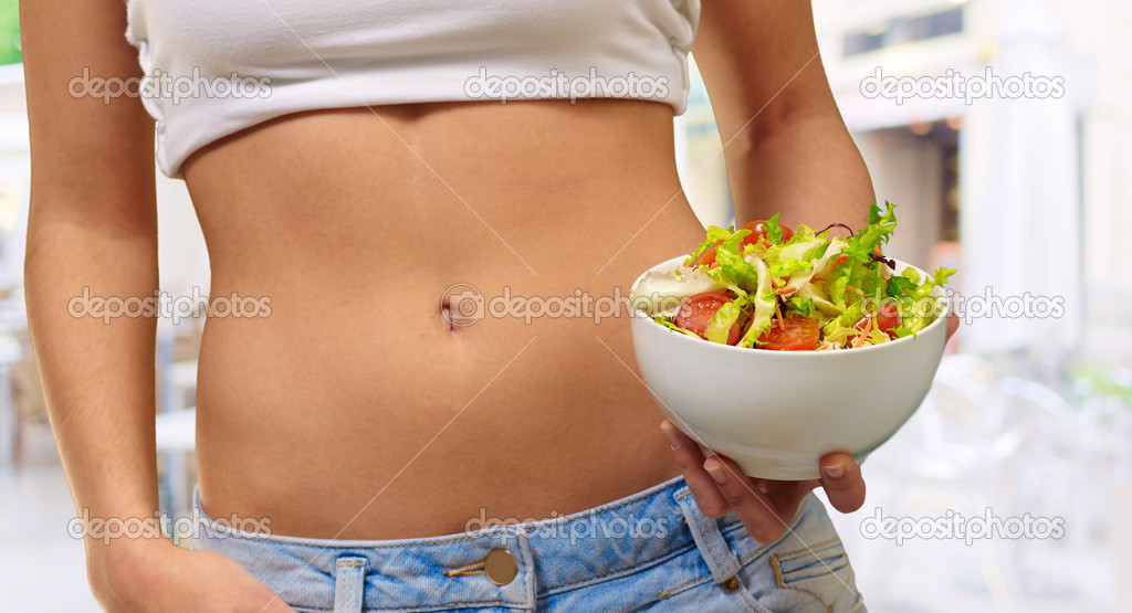 Female Holding A Bowl Of Salad