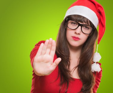 christmas woman doing a stop gesture