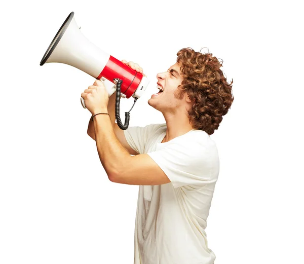 Portret van jonge man geschreeuw met een megafoon — Stockfoto