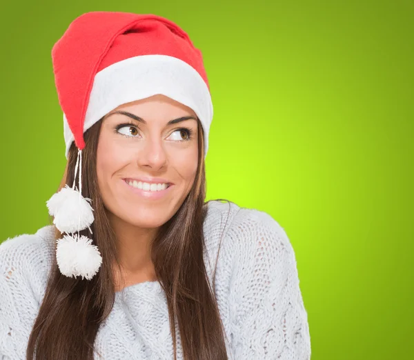 Happy christmas woman looking up Stock Picture