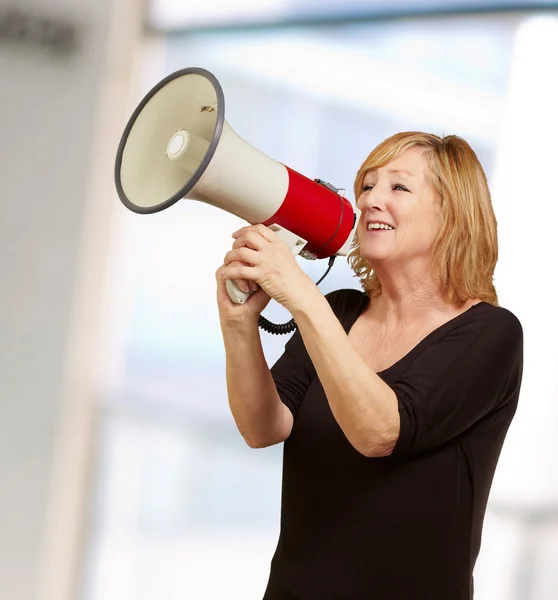 Woman with megaphone Royalty Free Stock Photos
