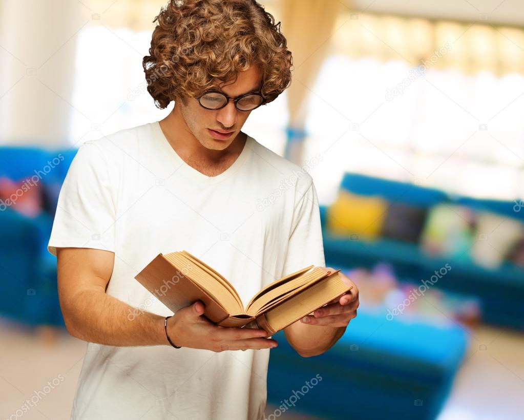 Young Man Reads A Book