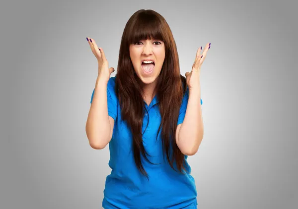 Portrait of a teenager screaming and angry — Stock Photo, Image