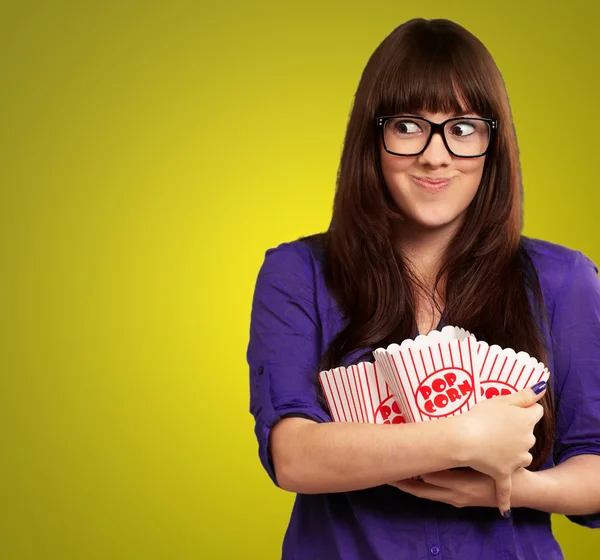 Woman Holding Empty Popcorn Packet — Stock Photo, Image