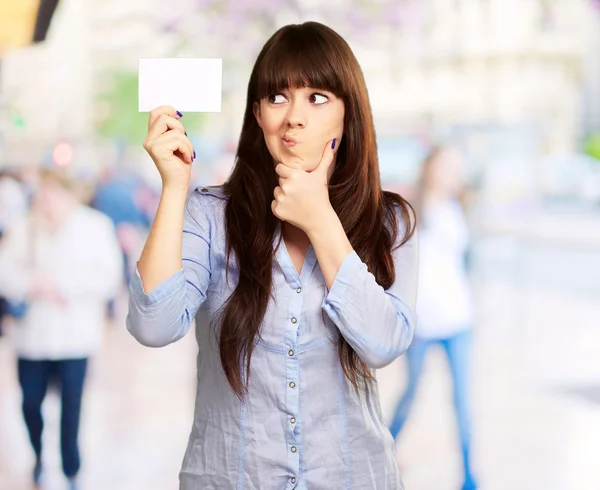 Portrait Of A Girl Holding And Making A Pout — Stock Photo, Image