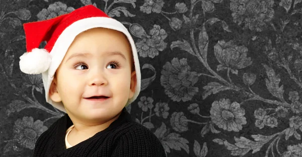 Chlapeček vánoční klobouk a vyhledávání — Stock fotografie