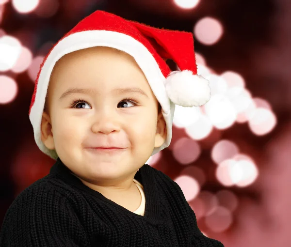 Baby boy smiling and wearing a christmas hat — Stock Photo, Image