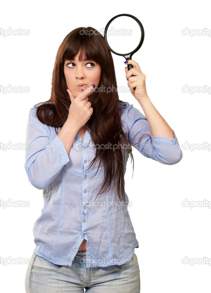 Portrait Of A Girl Holding A Magnifying Glass And Thinking