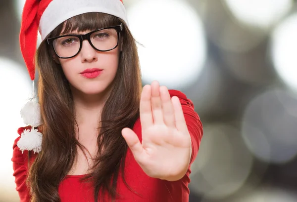 christmas woman doing a stop gesture