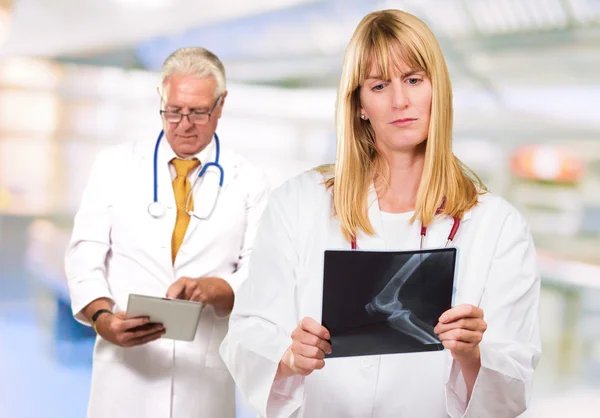 Portrait Of Two Busy Doctors — Stock Photo, Image