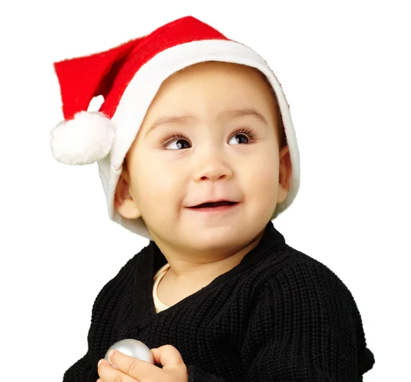 Menino usando um chapéu de Natal e olhando para cima — Fotografia de Stock