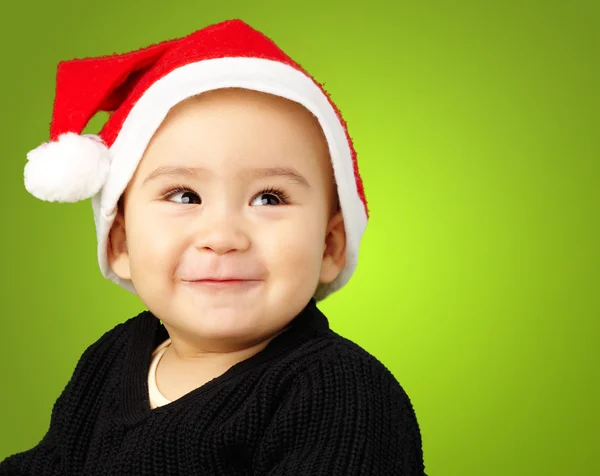 Baby boy smiling and wearing a christmas hat — Stock Photo, Image