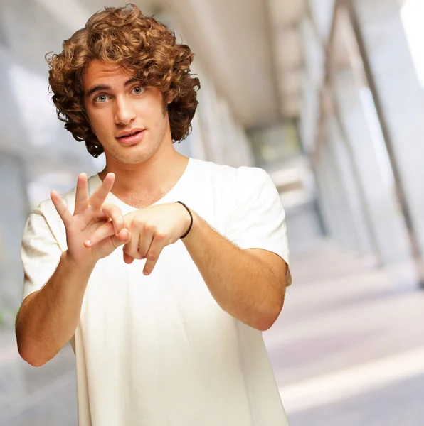 Portrait Of A Man Holding Index Finger — Stockfoto