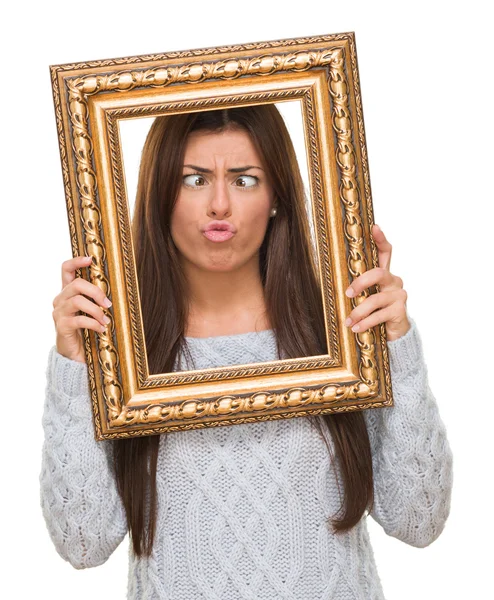 Divertido mujer joven sosteniendo el marco — Foto de Stock
