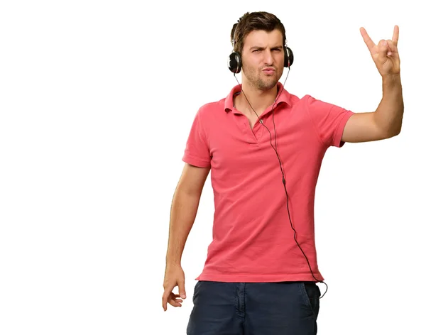 Homem jovem usando fones de ouvido — Fotografia de Stock