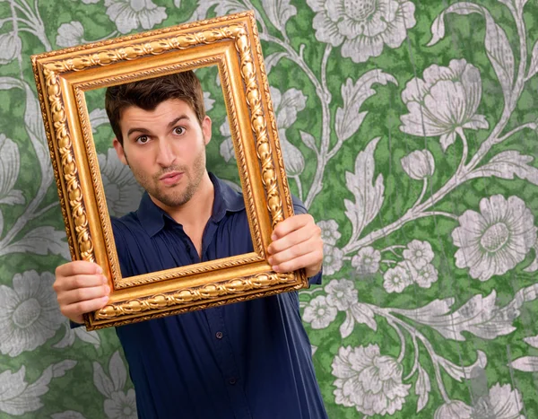 Young Man Holding Picture Frame — Stock Photo, Image