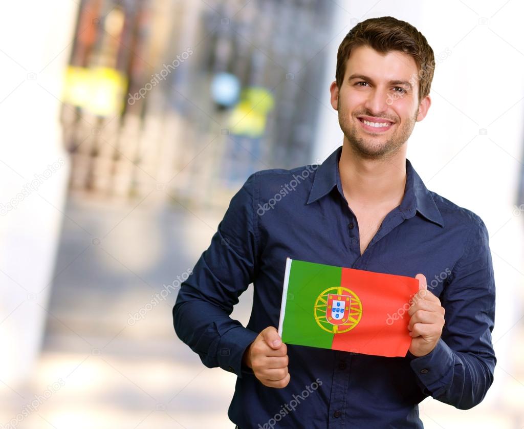 Young Man Holding Portuguese Flag