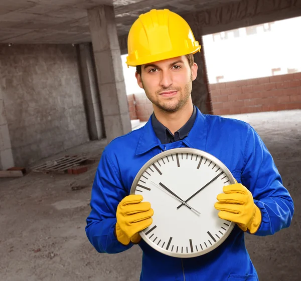 Engineer Holding Wall Clock — Stock Photo, Image