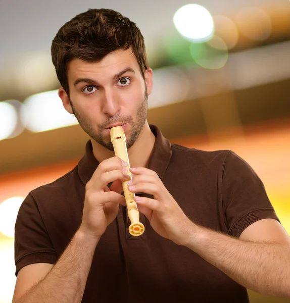 Portrait Of A Young Man Playing Flute — Stock Photo, Image