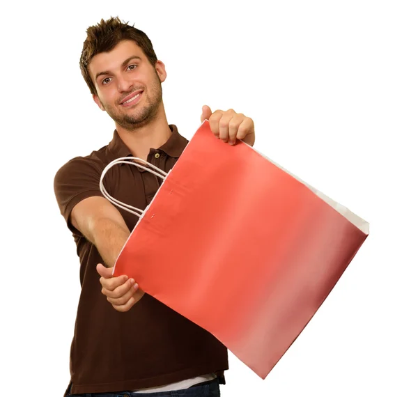 Junger Mann mit Einkaufstasche — Stockfoto