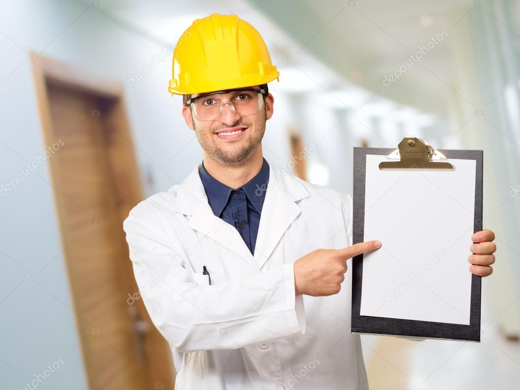 Architect Pointing On Clipboard