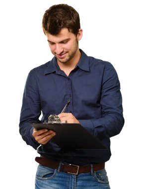 Young Man Writing On Clipboard
